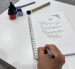 EyeXcite artist writes a piece of story with hand.